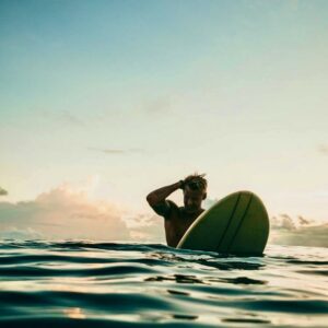 man on surfboard in ocean