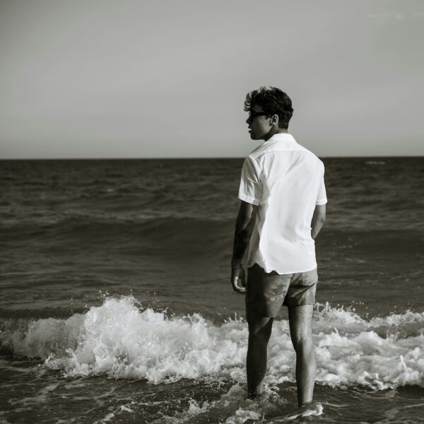 man on the beach water